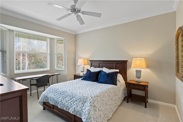 carpeted bedroom featuring ornamental molding and ceiling fan