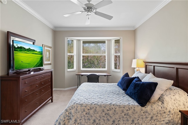 carpeted bedroom with ceiling fan and ornamental molding