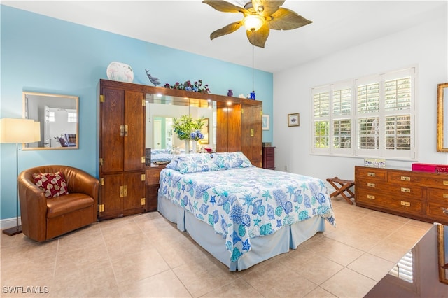 bedroom featuring ceiling fan and light tile patterned floors