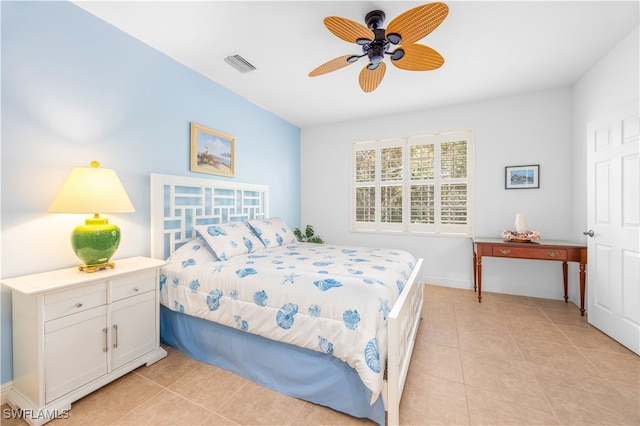 bedroom featuring light tile patterned floors and ceiling fan