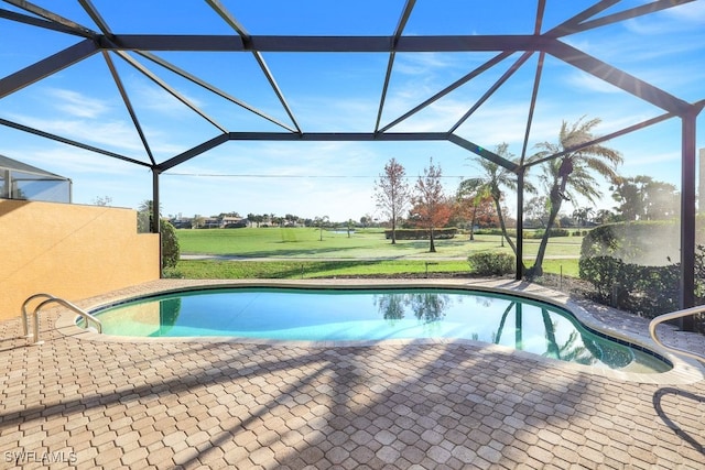 view of pool with a patio and a lanai