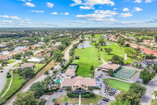 bird's eye view featuring view of golf course and a water view