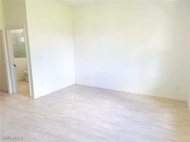 unfurnished room featuring light hardwood / wood-style flooring