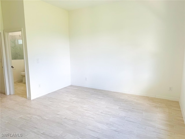 empty room with light hardwood / wood-style floors