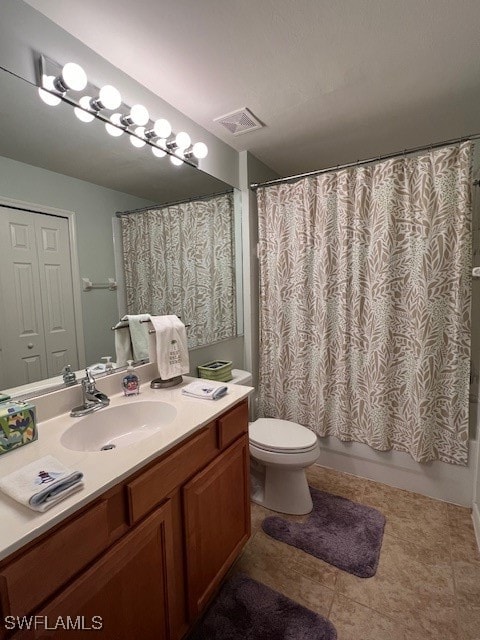 full bathroom featuring toilet, vanity, tile patterned floors, and shower / bathtub combination with curtain