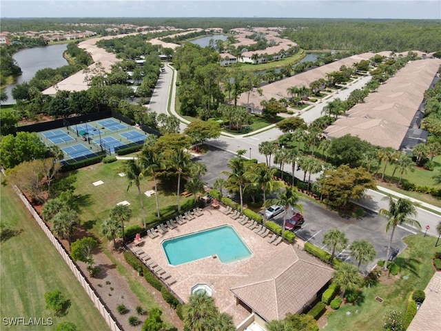 birds eye view of property with a water view