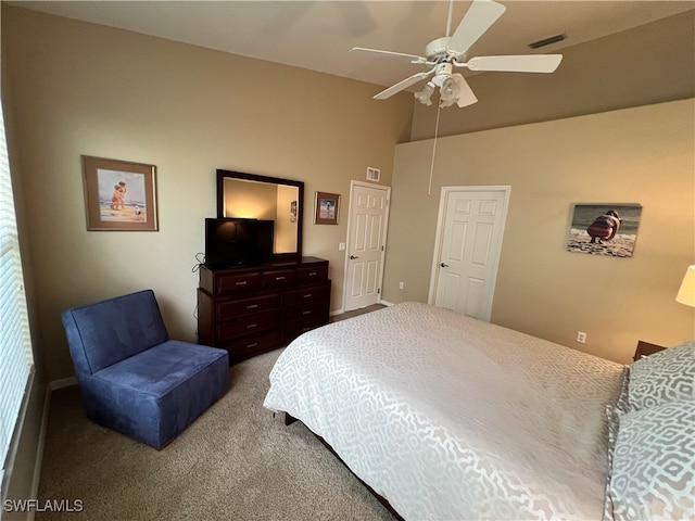 carpeted bedroom featuring ceiling fan and lofted ceiling