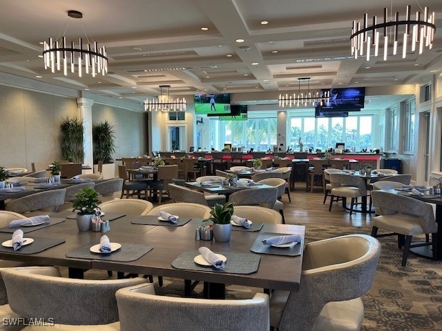 dining space with hardwood / wood-style floors, a notable chandelier, coffered ceiling, and beam ceiling