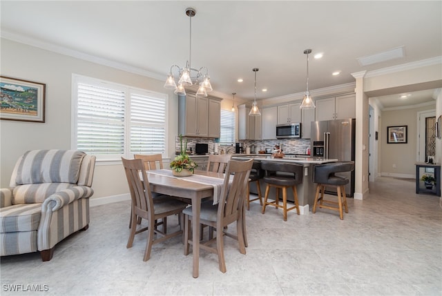 dining space with an inviting chandelier, crown molding, and light tile patterned flooring