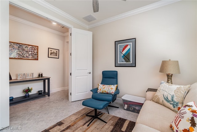 sitting room with crown molding, light tile patterned floors, and ceiling fan