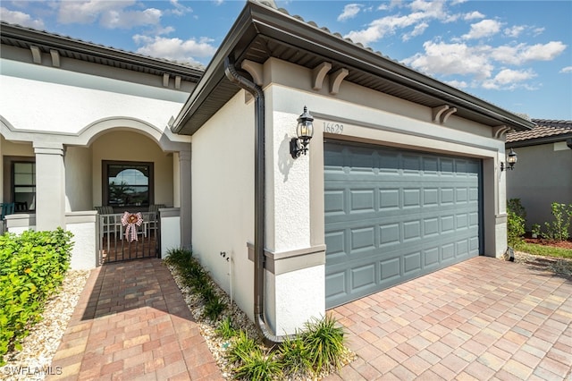 view of side of home featuring a garage