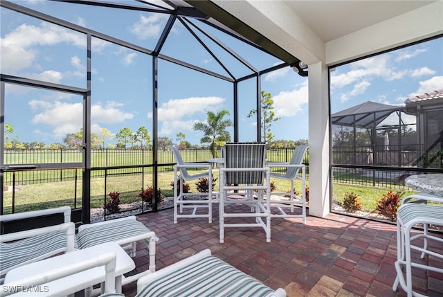 view of patio featuring a lanai