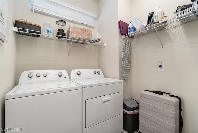 clothes washing area featuring washing machine and dryer