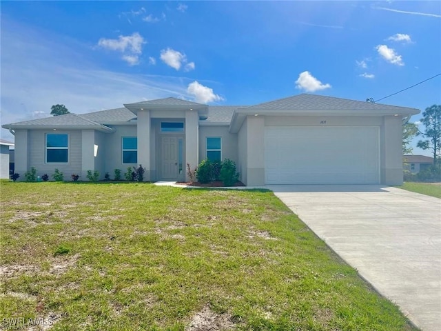 single story home with a garage and a front lawn