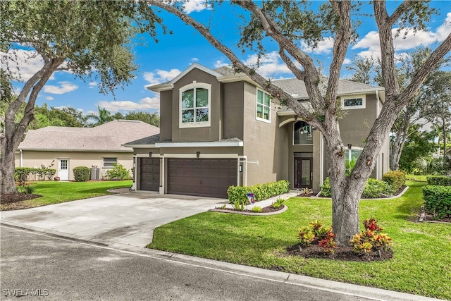 view of front of property with a front yard and a garage