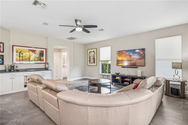 living room featuring ceiling fan