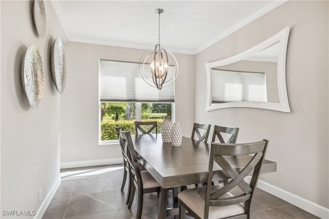 tiled dining room featuring crown molding and an inviting chandelier