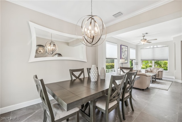 dining room with ceiling fan with notable chandelier and ornamental molding