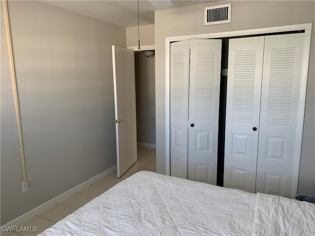 bedroom featuring light tile patterned floors