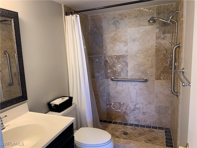 bathroom with toilet, curtained shower, and vanity