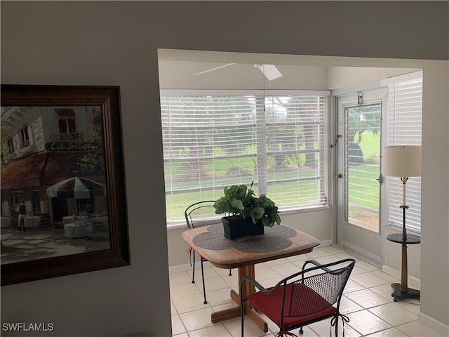 dining area with light tile patterned flooring