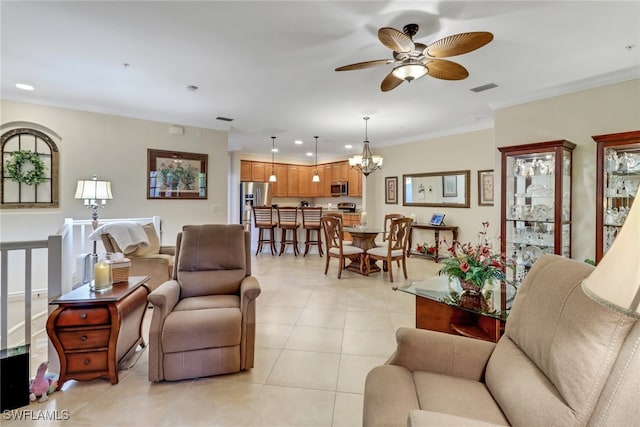 living room with crown molding, ceiling fan with notable chandelier, and light tile patterned floors