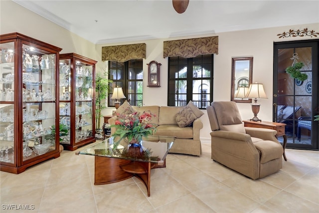 tiled living room featuring crown molding