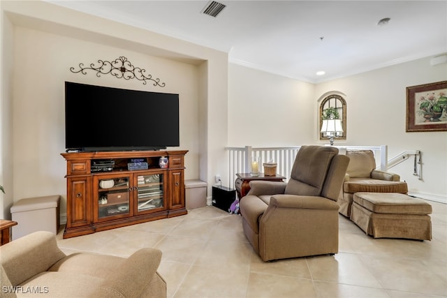 living room featuring ornamental molding and light tile patterned floors