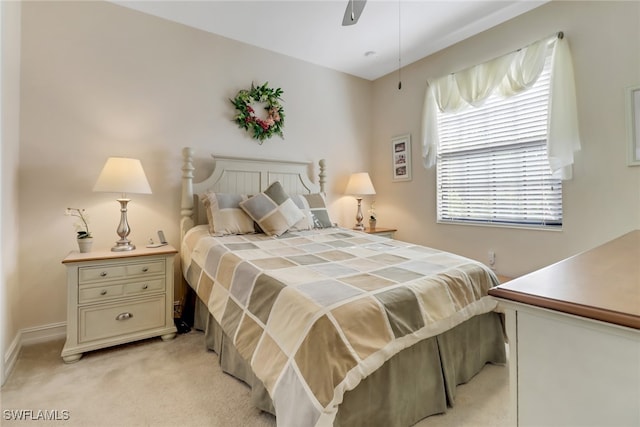 bedroom with light colored carpet and ceiling fan