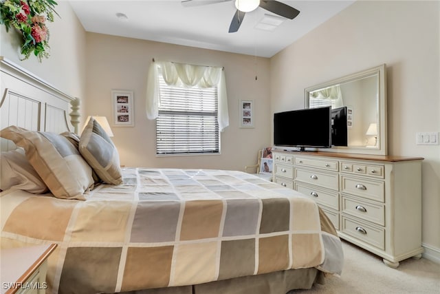 bedroom featuring light carpet and ceiling fan