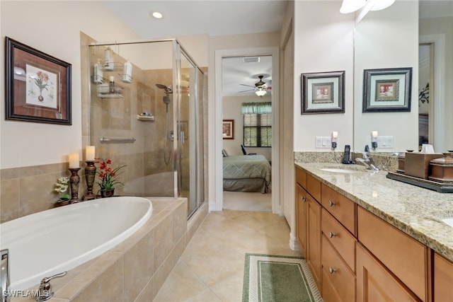 bathroom featuring vanity, tile patterned floors, and plus walk in shower