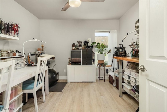 office area featuring light hardwood / wood-style flooring and ceiling fan