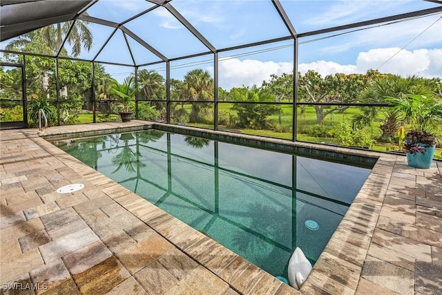 view of pool featuring a lanai and a patio area