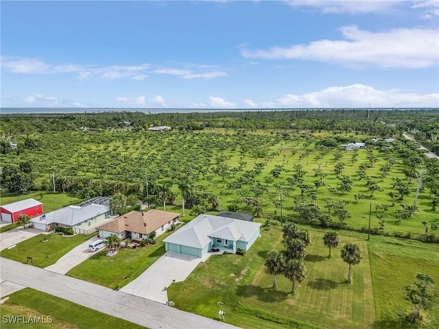 birds eye view of property with a rural view