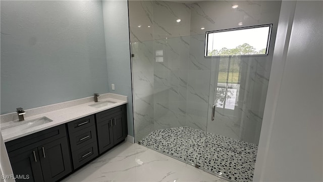 bathroom with vanity and tiled shower