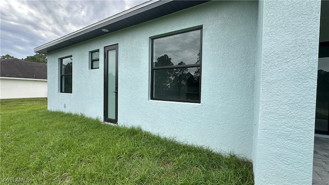 view of home's exterior featuring a yard