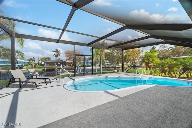 view of pool featuring a lanai and a patio