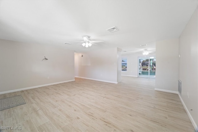 empty room featuring ceiling fan and light hardwood / wood-style flooring