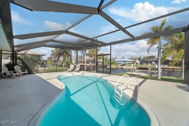 view of swimming pool with a water view, glass enclosure, and a patio area