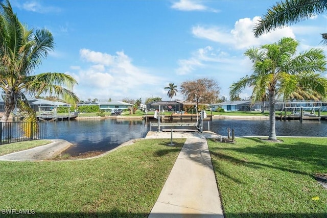 water view featuring a boat dock and a residential view