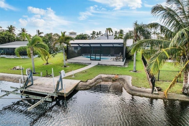 view of dock with a lawn, a water view, boat lift, and a lanai