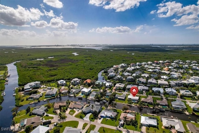 bird's eye view with a residential view and a water view