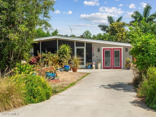 back of house featuring french doors