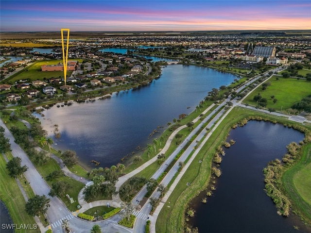 aerial view at dusk with a water view