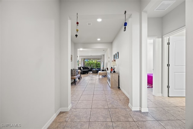 hallway with light tile patterned floors