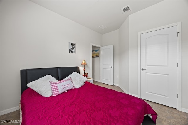 bedroom featuring light tile patterned floors