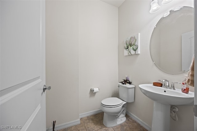 bathroom featuring tile patterned flooring and toilet