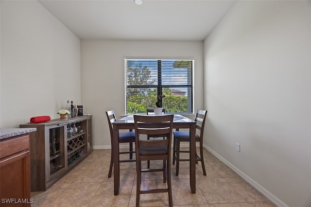 dining room with light tile patterned flooring