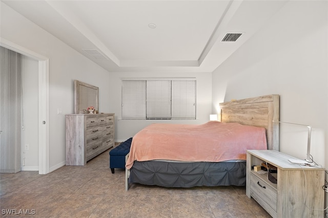 bedroom with a tray ceiling