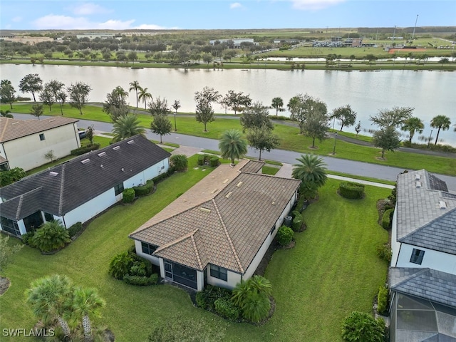 drone / aerial view with a water view